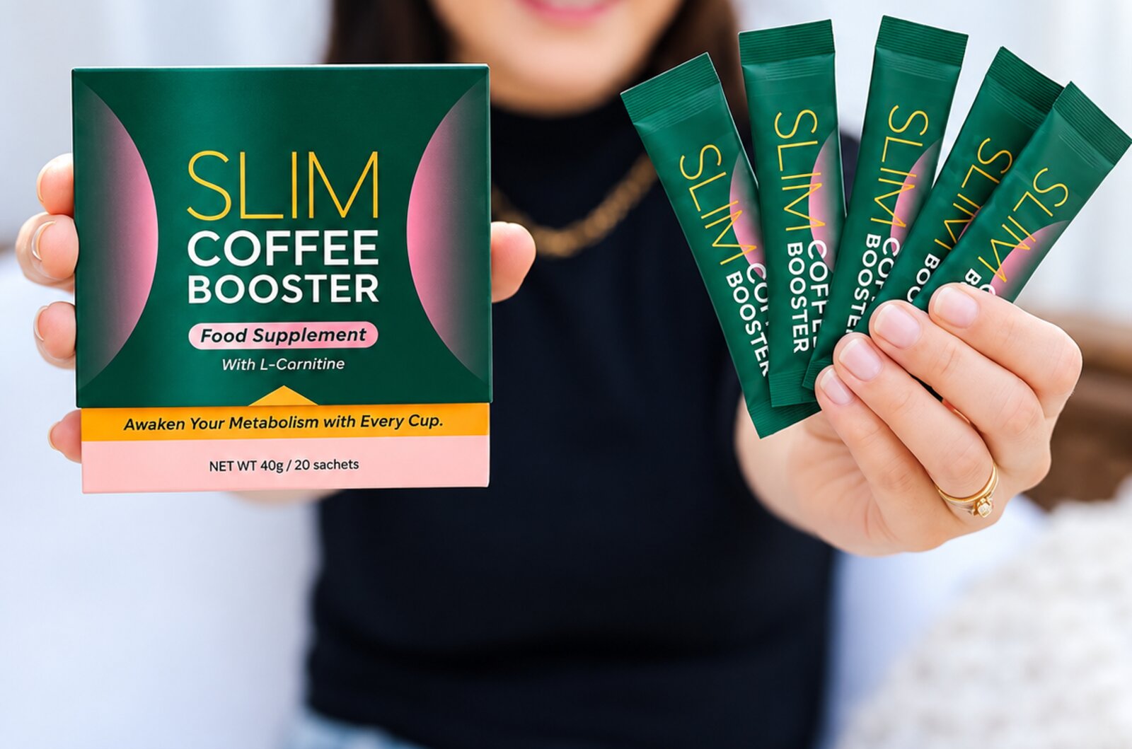 Woman holding Slim Coffee Booster sachets in a kitchen